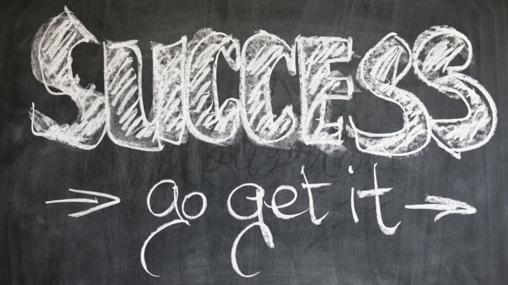 blackboard that says "success, go get it"