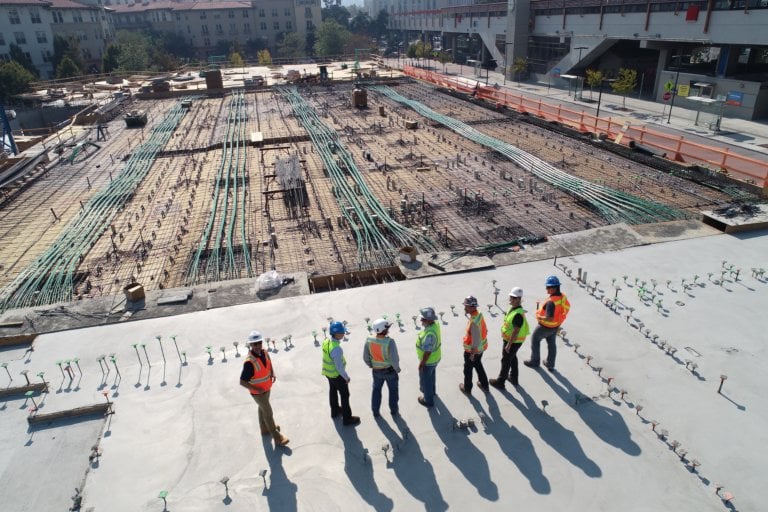 Employees looking at a work site