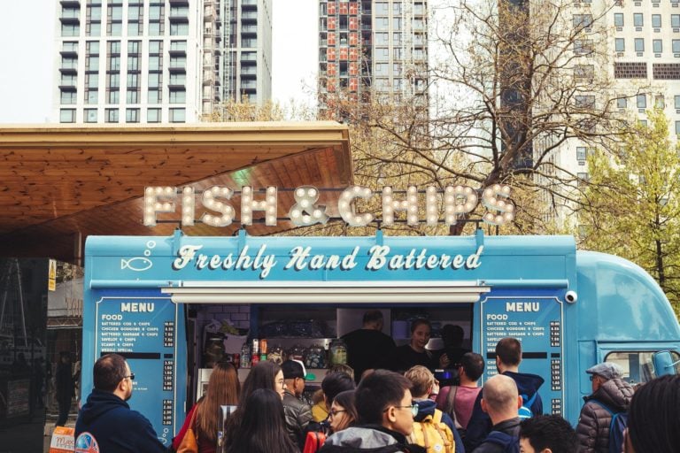 People gathered around a food truck