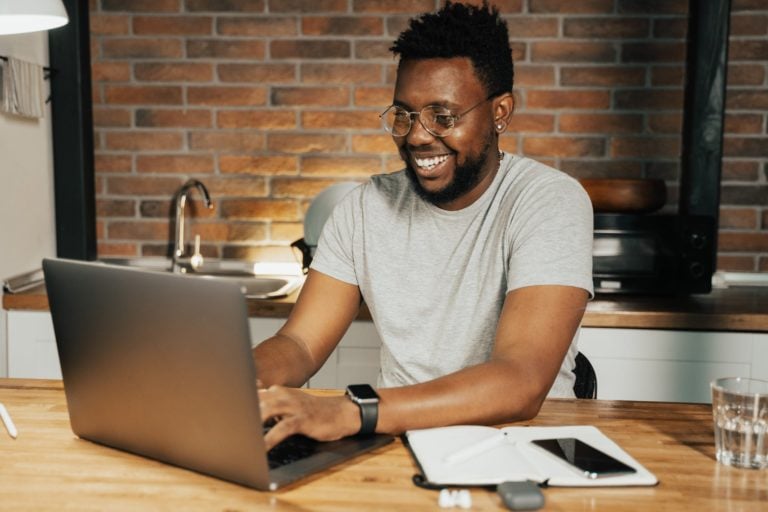 A worker who is happy to be telecommuting from home