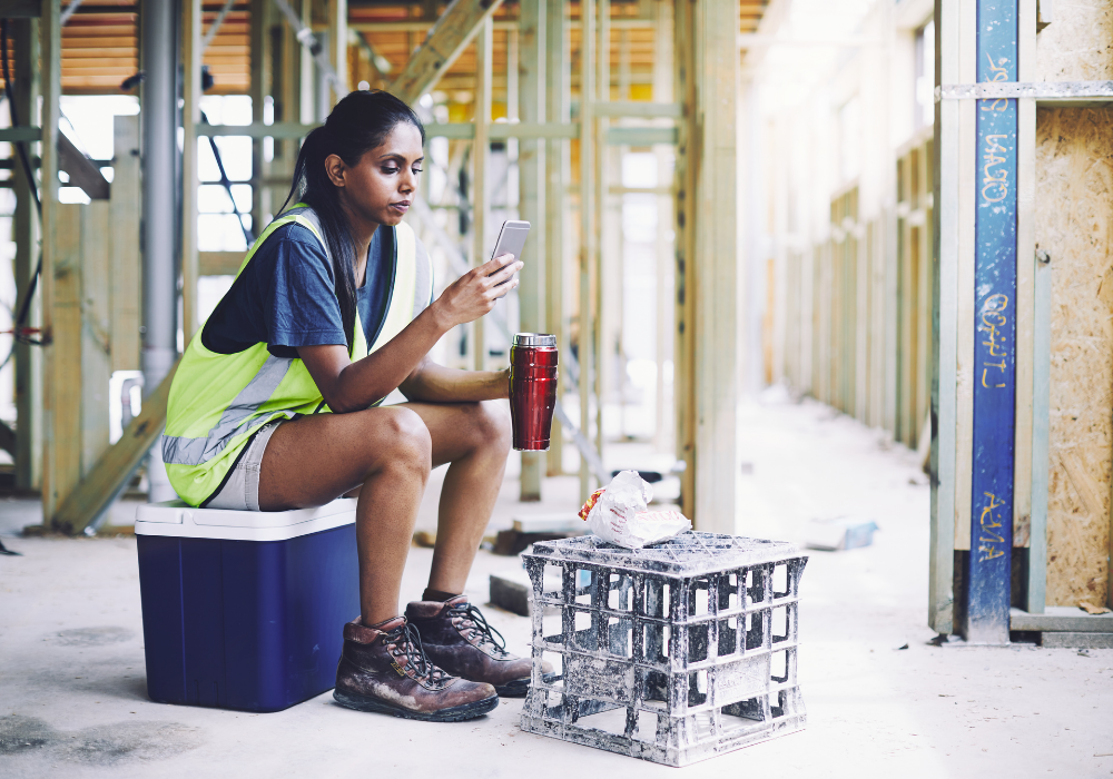 Deskless worker using a workplace chat app to communicate with her co-workers.