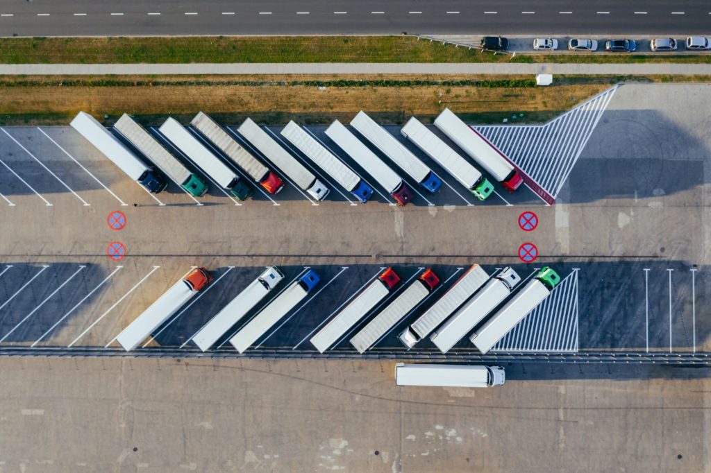 Overhead view of trucks in a parking lot.