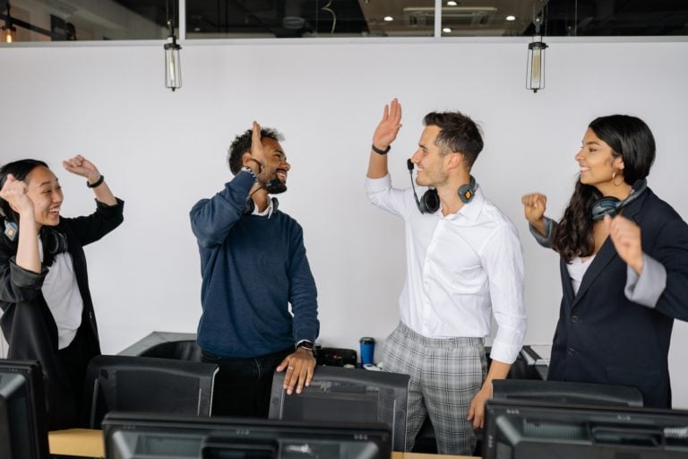 Employees celebrating a job well done to show recognition