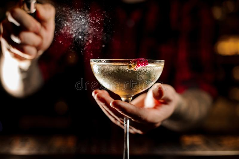 Stock photograph of a bartender making a cocktail.