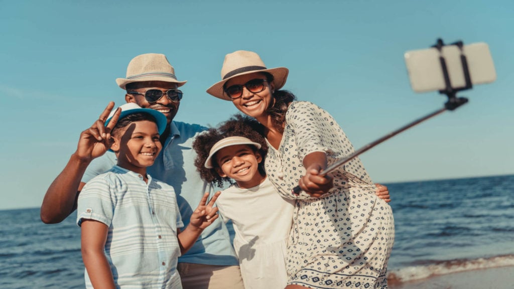 An African American family enjoys a family vacation thanks to paid time off