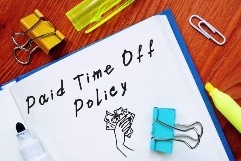 An open notebook illustrating how to create a standard PTO policy for small business