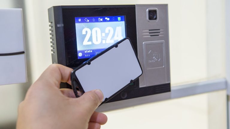 An employee clocks into work using a time entry system