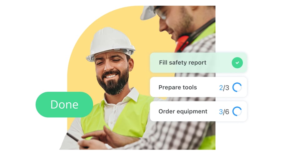 Two construction workers wearing hard hats, ticking off their tasks from their Connecteam checklist feature.