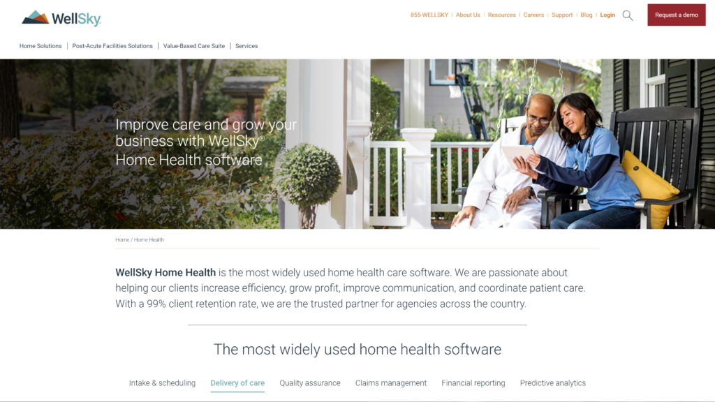 A screenshot of the WellSky website, displaying a smiling woman caregiver showing an aged man something on a tablet.