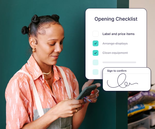 A woman using the Connecteam app to mark items off a checklist and sign to confirm