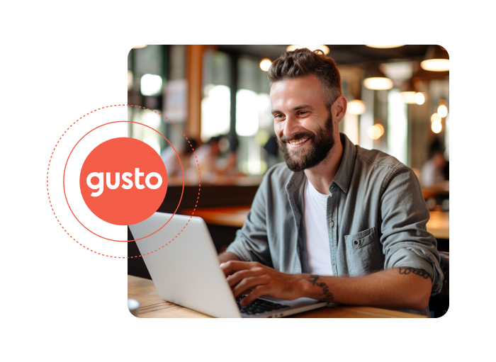 a picture of a man looking at the computer and smiling with Gusto logo