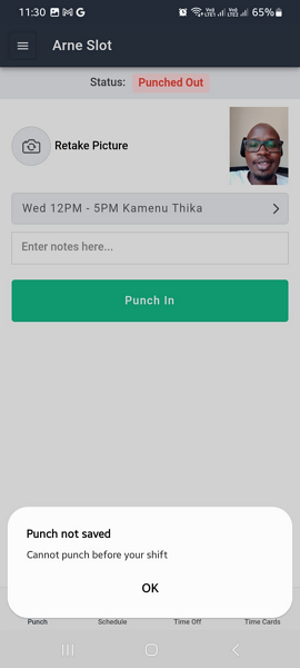 A mobile app screenshot showing a punch-in screen for "Arne Slot" with a status of "Punched Out," a scheduled shift of Wed 12PM–5PM at Kamenu Thika, and a dialog error message reading "Punch not saved – Cannot punch before your shift."