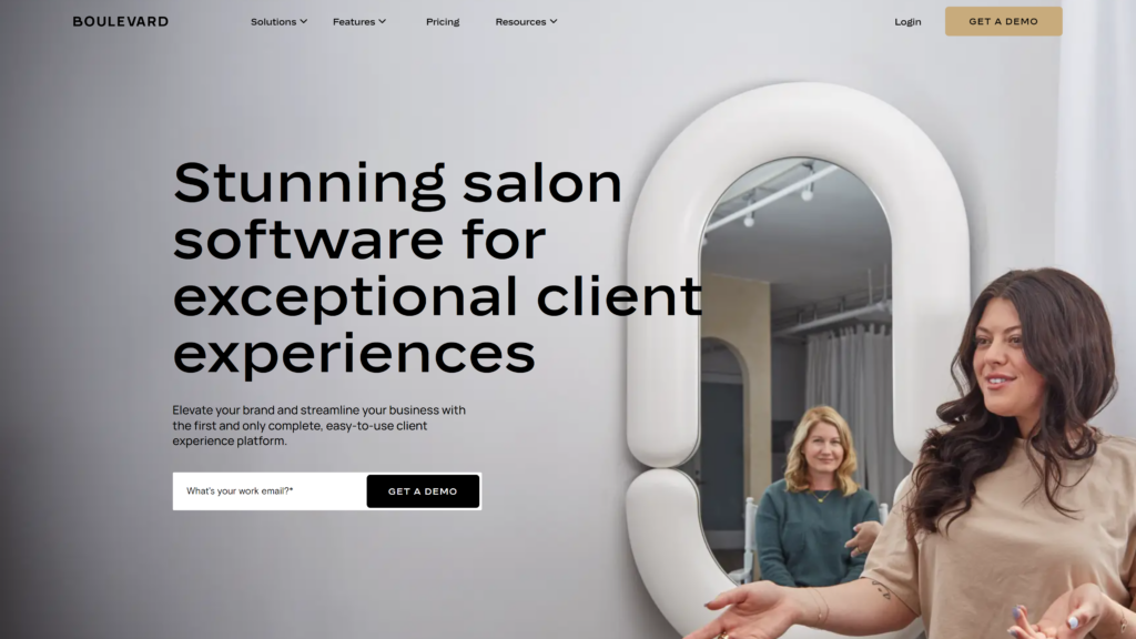 Screenshot of Boulevard's salon software homepage featuring a prominent headline with an image of a woman speaking in a salon setting.