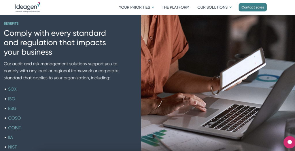 Screenshot of Ideagen website, showing an image of a person in an orange shirt working on a laptop. Text on the left details Ideagen’s audit and risk management solution.