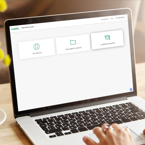 An image of the Roubler e-learning platform, with options to navigate to My Profile, the Documents Library or the Learning Academy.