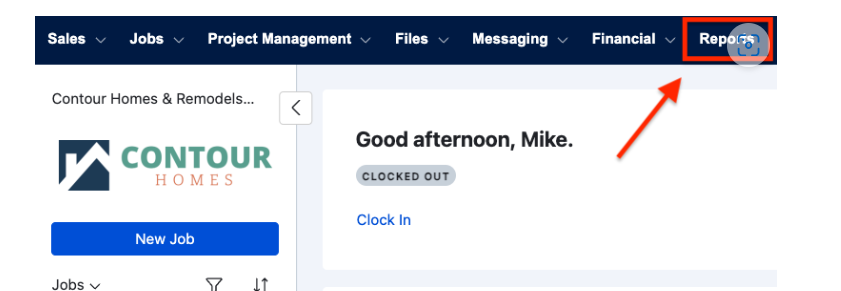 Buildertrend’s dashboard showing navigation tabs like Sales and Jobs. A message reads, “Good afternoon, Mike. Clocked Out.” A red arrow points to the Reports tab.