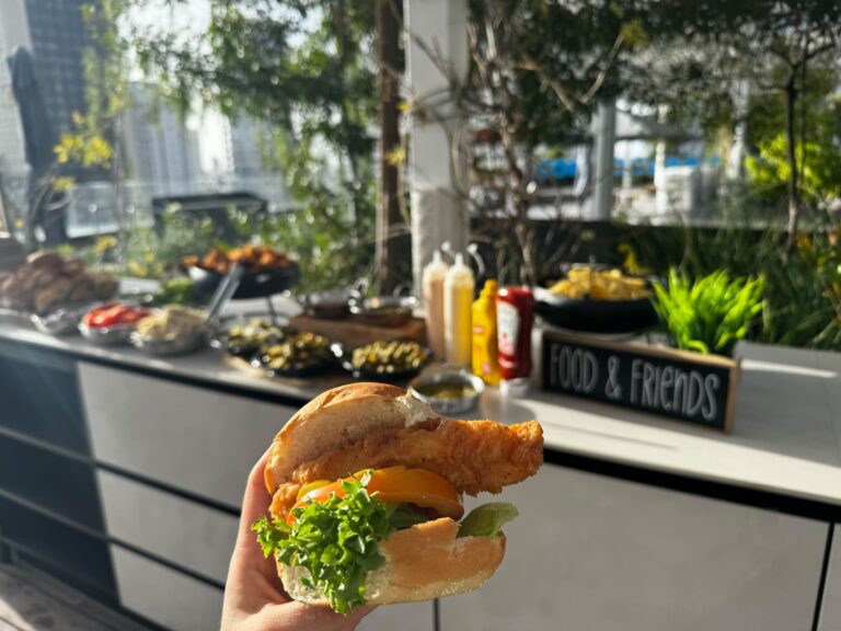 Employee happy hour spread with chicken sandwiches and condiments