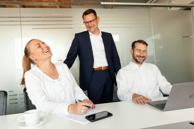 work colleagues laughing at something funny