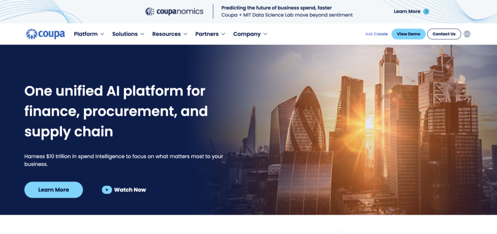 The homepage of the Coupa website features a city skyline at sunset fading into a deep blue background with the headline, 